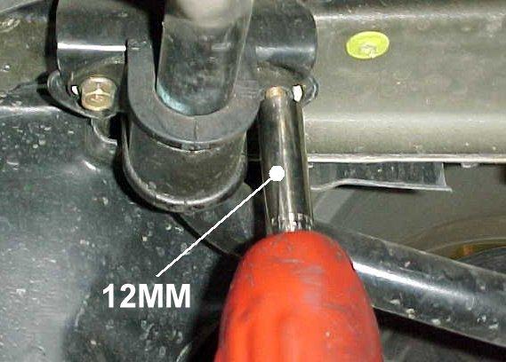 5) Use a 12mm socket or wrench to loosen and remove the bolts holding the sway bar bushings and bushing retainer
