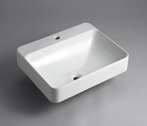 Vox Rectangle Vessel with Faucet Deck Product Intent: Sleek and contemporary, the Vox Rectangle vessel-style sink features a wide, shallow basin and rounded edges in true minimalist fashion.