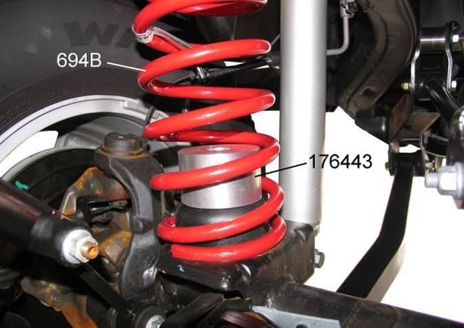 BUMP STOP SPACER, COIL SPRING & SHOCK ABSORBER INSTALLATION 1) Drill a 5/16" hole through the center of the coil spring axle pad. For ease of installation, tap the hole (3/8-16).