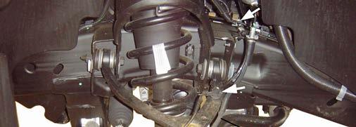 NOTE: For vehicles equipped with Autoride (Electronic Suspension Control), separate brake hose from sensor link bracket. 2) Remove the brake caliper anchor bolts.