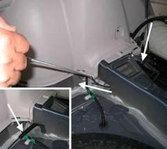 Once wiring is in the trunk area, route wire through small access hole in the cross member behind