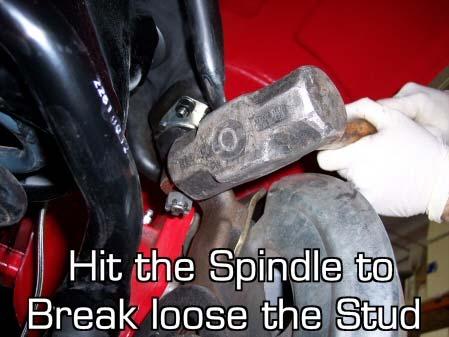 securing the upper ball-joint to the spindle.