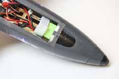 17. Install the battery pack in the nose and