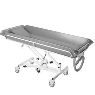 Shower Trolley This hydraulic bed works on a foot pedal and allows the bed to be raised and lowered as