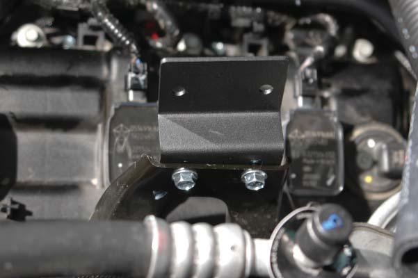 Use a 10mm socket to mount the provided intercooler reservoir to the left side rear intake