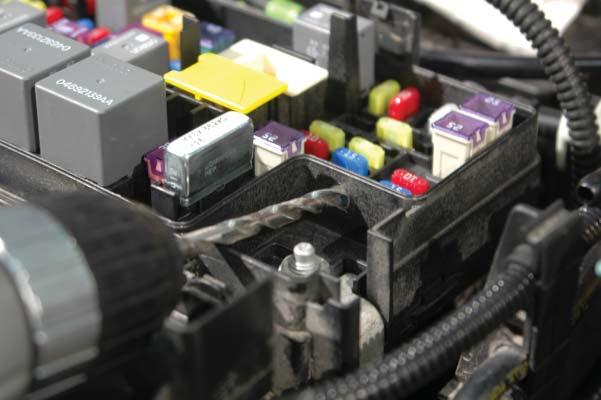 wire. 143. Remove the fuse box cover.
