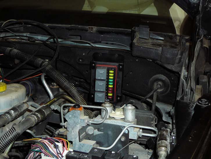 Twelve inches down the harness from the fuse block is a harness breakout. The late model accelerator pedal, DLC, battery temp sensor connectors and many open ended wires protrude from this breakout.