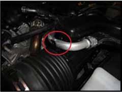 7. Dislodge the three coolant lines attached to the