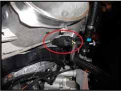 12. Unplug harness from temperature sensor in EGR piping.