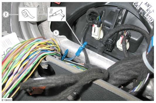 Second CAN bus wiring harness splice. Insert the twisted ends of the wires into the solder/heat shrink connector. CAUTION: Do NOT damage any surrounding wiring. 2.
