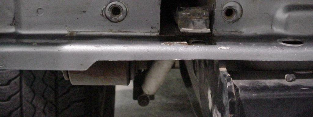 installation. 2. Using a hack saw blade, die grinder or saws-all, cut access holes in the back of the sub frame to gain clearance for the frame brackets. See Figure 1.
