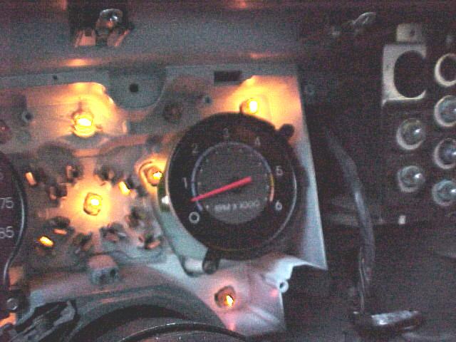 Page 27 Remove tachometer by again rocking it back and worth while pulling outward. Image 14 At this point, you should be able to see the 8 lamps that illuminate the gauge cluster.