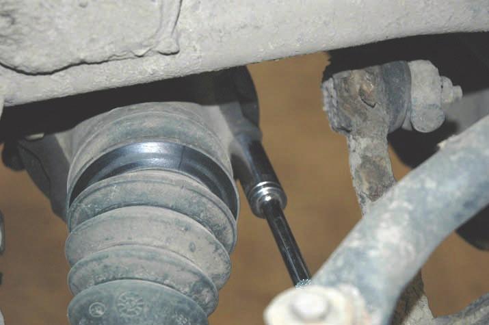 Remove the upper and lower shock bolts using a 18mm socket and wrench. Remove the shock. 15.