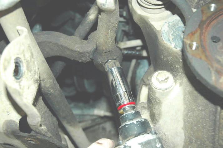 Lightly hit the end of the center link to dislodge the tie rod.