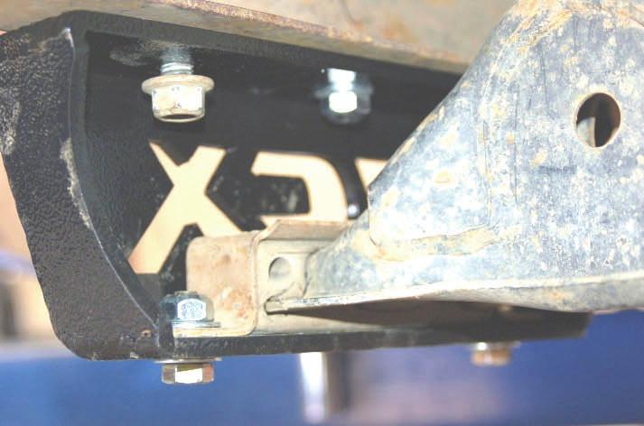 Use the stock bolts with head of the bolt pointing toward the rear and the threads to the front. This is done for clearance on the steering link. See Photo 25. Photo 24 Photo 25 37.