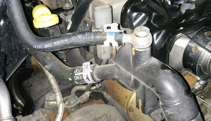 coolant pipe to the thermostat housing and