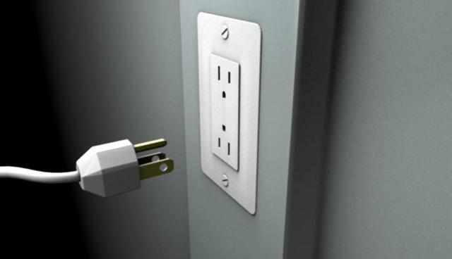 Wall Socket Has a voltage difference across the two holes of an