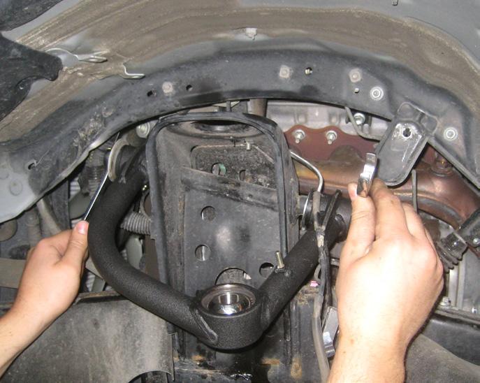 Do not tighten at this point. Repeat procedure on the passenger side. 10. Locate the new upper control arms.