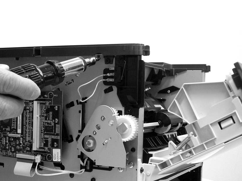 3. Remove one screw (1) on the left side of the printer, and remove one screw (2) on the right