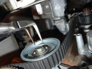 Note that the new timing belt will appear shorter as it is not as stretched as your old one. It WILL be harder to slip on. 6.