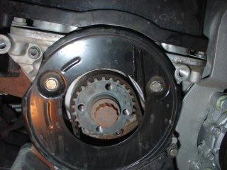 dampener and you will get it out: 12. Finally, remove the lower and middle timing belt covers. There are total of five 10mm bolts.
