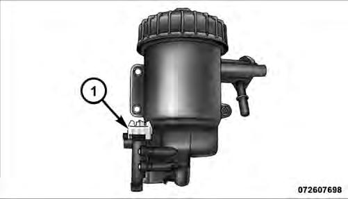 NOTE: The fuel/water separator drain valve is located on the bottom of the fuel filter housing.