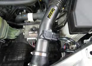 Install the reducing coupler onto the end of the intake pipe and secure with the #44 hose clamp (I).
