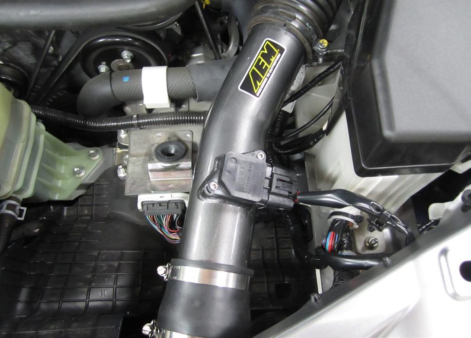 Install the reducing coupler onto the end of the intake pipe and secure with the #44 hose clamp (I).