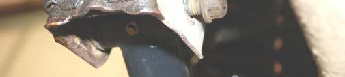 Remove the stock upper control arm by removing the factory hardware from the axle bracket and