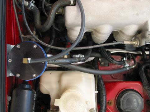 (See Figure 25) Step 4: Remove original fuel return hose that connects to factory fuel pressure regulator.