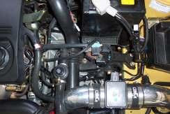 Note: The 3-way valve positioning described here assumes the car has a CAI installed. The valve can be mounted wherever desired if you choose to not use the recommended spot. c. Position the 3-way valve on the shelf with the valve s black end facing the car s front with Port 3 facing up.