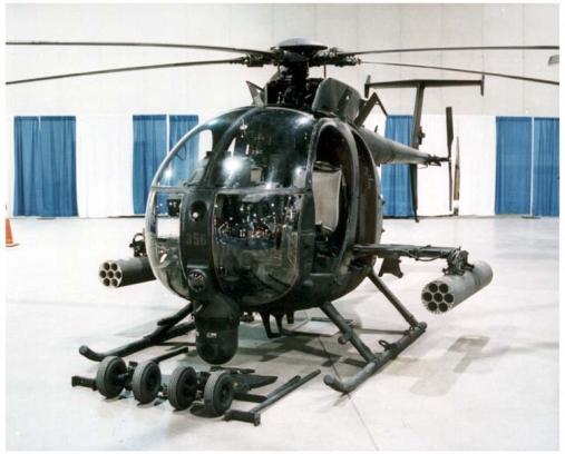 Fig. 77. The AH-6 Little Bird. The Boeing AH-64 Apache (fig. 78) is a four-blade, twin-engine attack helicopter with a tailwheel-type landing gear arrangement, and a tandem cockpit for a crew of two.