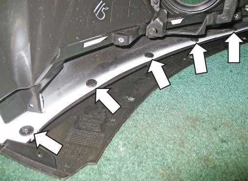 5. Remove the eight (8) push pins retaining the splitter to the fascia, as well as
