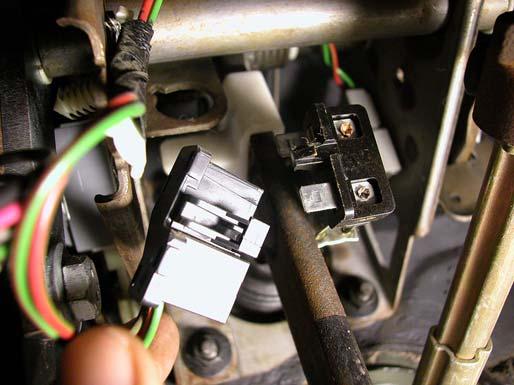 8. Disconnect the brake light switch electrical connections, and remove it from the pushrod mounting stud on the brake pedal arm. 12. Disconnect the clutch cable from the clutch quadrant.