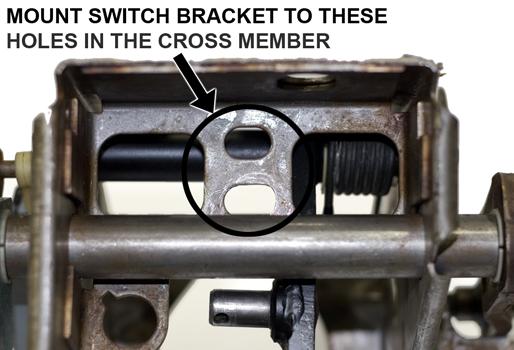 in the MM Switch Bracket (larger hole is for the vacuum switch). 24.