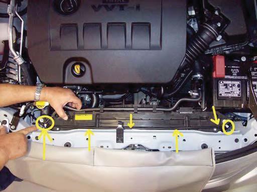 Remove fog light cover plates on both sides of vehicle 30.