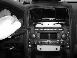 4. Remove the screws securing the radio and pull the radio from the dash and disconnect the wiring.
