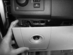 8. Gently pull the lower dash panel loose to release the