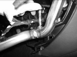 12. Route the amplifier harness from the radio cavity to the area under the steering column. 13.