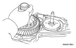 Remove the spring washer from the differential carrier. Fig.