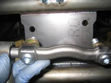 Install the upper control arm into position using the supplied 9/16-18 x 2 1/4 button head bolts.