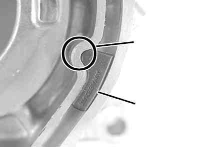 Apply grease to the sleeve, which Return spring attach to the bearing in the clutch lifter plate.