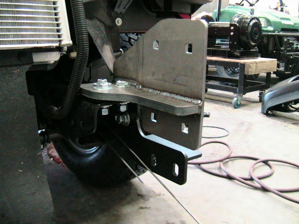 2. Install the outer frame bracket to both sides of the vehicle. See Figure 2 and 3. Use the supplied 5/8 hardware.