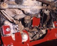 11. Install driver side differential drop bracket using OEM bolts in two bottom holes. Apply loctite and torque to 70 Ft. Lbs. Use 1/2 x 1 1/2 hex bolts, washers, and lock nuts in two upper holes.