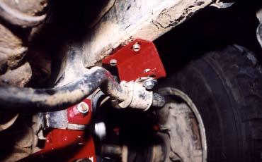 Clean out hole on top of steering knuckle (spindle). 14. As shown in Photo #12, insert tapered spindle sleeves with small end downward.