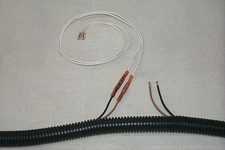 69. Locate the MAF electrical plug, pull back the fl ex loom about 12, and cut the tan wire and the tan w/black stripe wire about 2 from the MAF connector. 70.