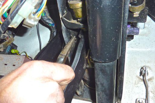 Step 46 Position the left leg of the brake pedal spring in the hole in the