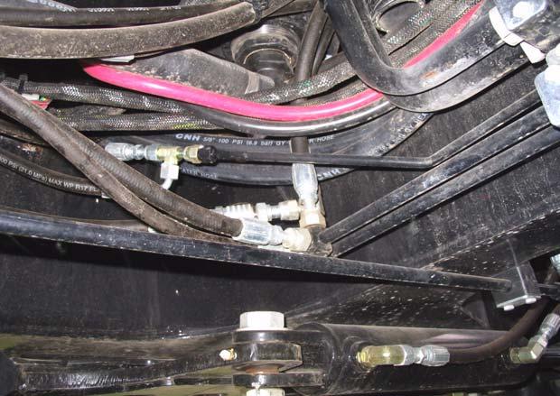 Figure 8-5 Connecting the AutoFarm Pressure Hose To connect the AutoFarm tank hose, follow the steps below: 1. Identify the -8 tee under the right side of the vehicle.