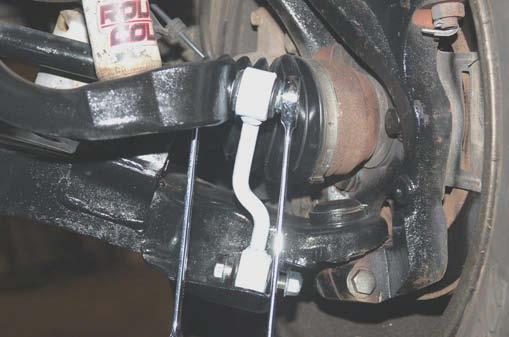It may be necessary to use jack stand to install the lower bolt.