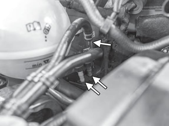 47) Reconnect the three rubber lines on the right side of the intake manifold. Make sure the lines are oriented correctly and connect them back in their appropriate positions.